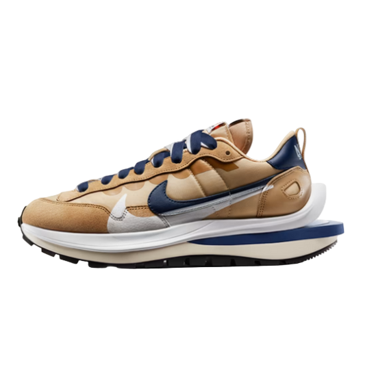 Tan and blue sneaker with Nike logo on a light gray background