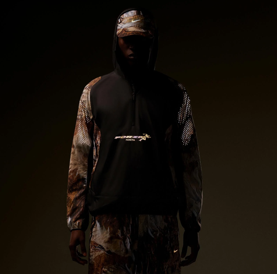 NIKE NOCTA FORZA RUNNING MOUNTAIN WINDBREAKER (BLACK SAFARI CAMO)